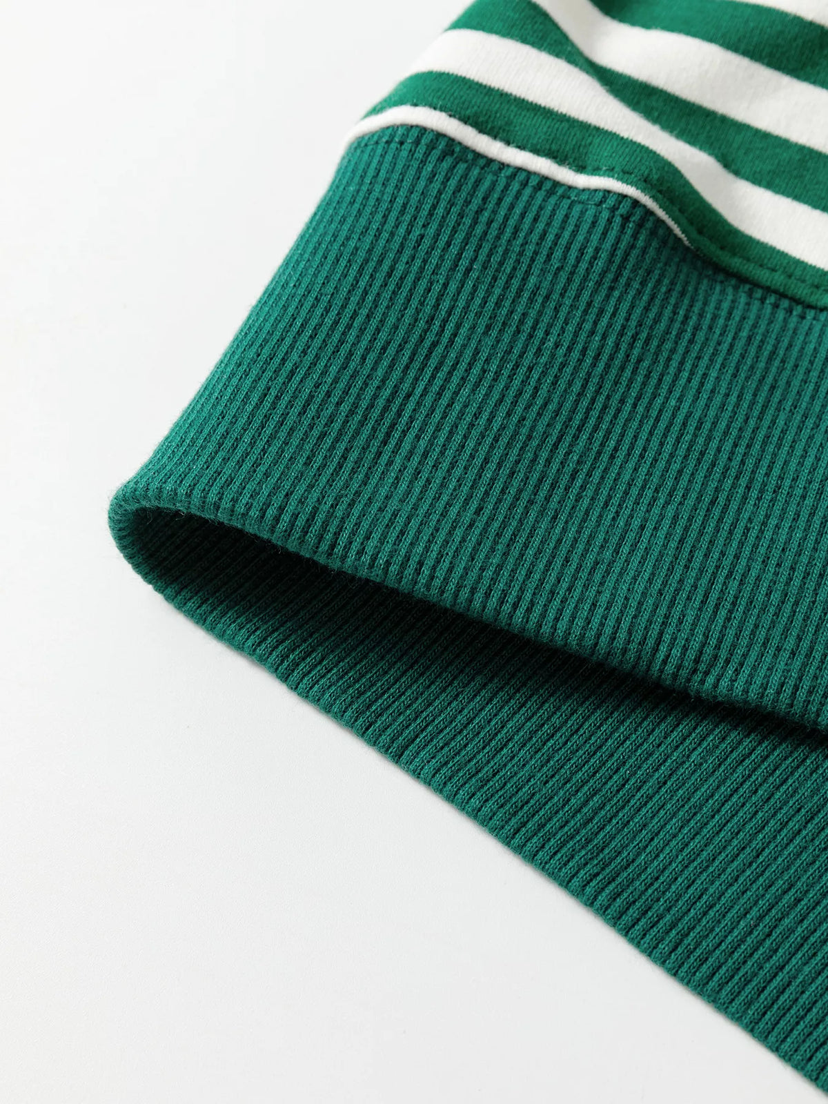 Close-up of the green ribbed hem band