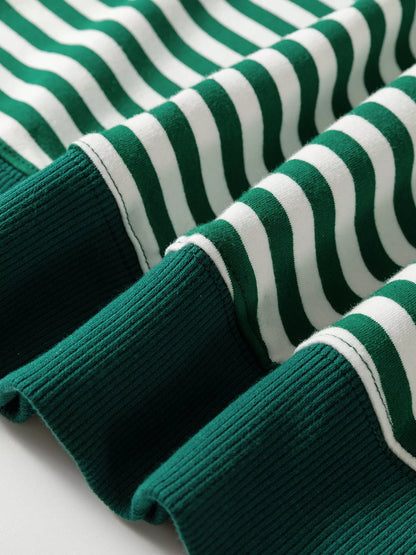 Close-up of the striped body and green ribbed hem